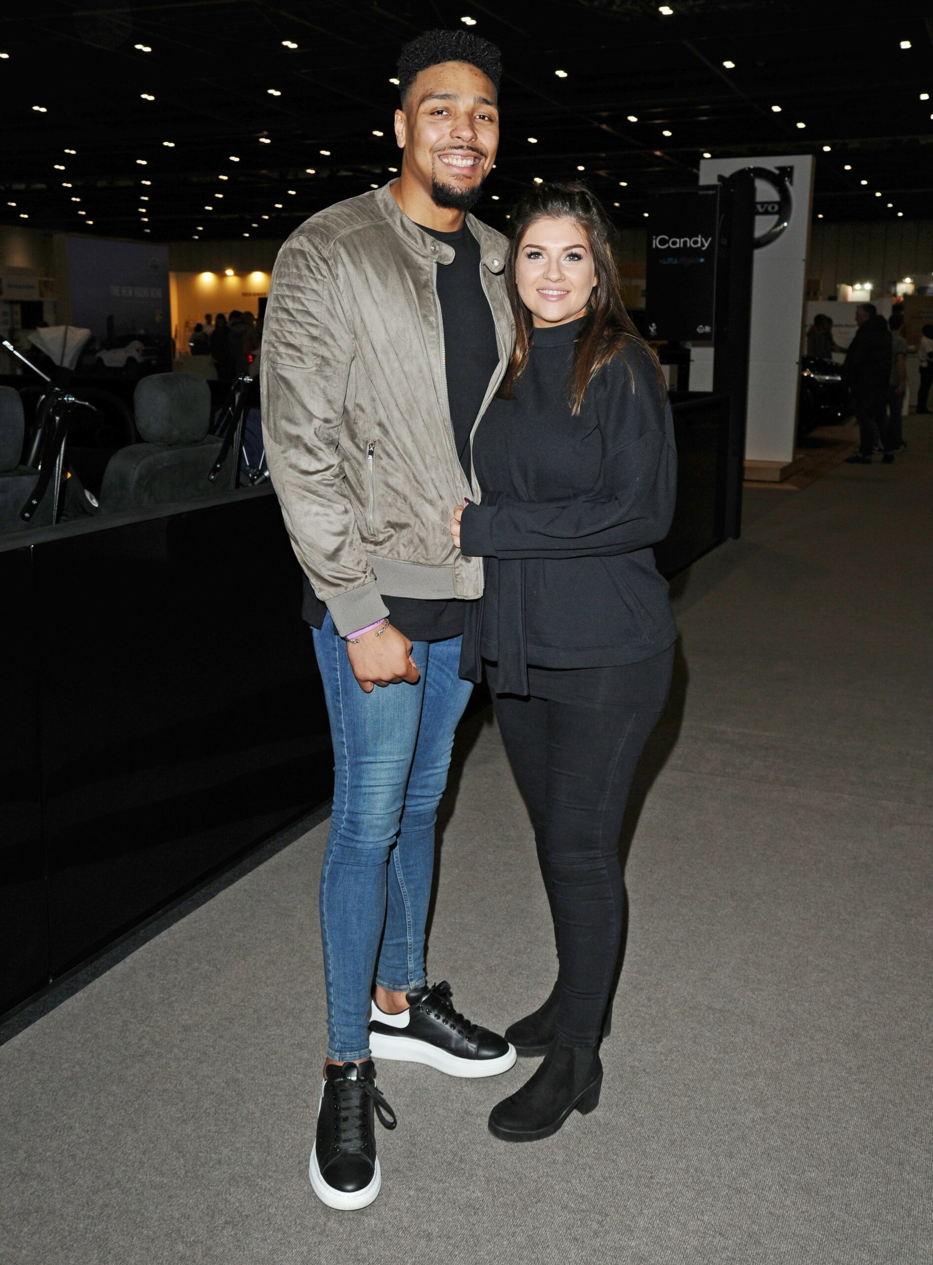 Jordan Banjo and wife Naomi Courts smiling at event