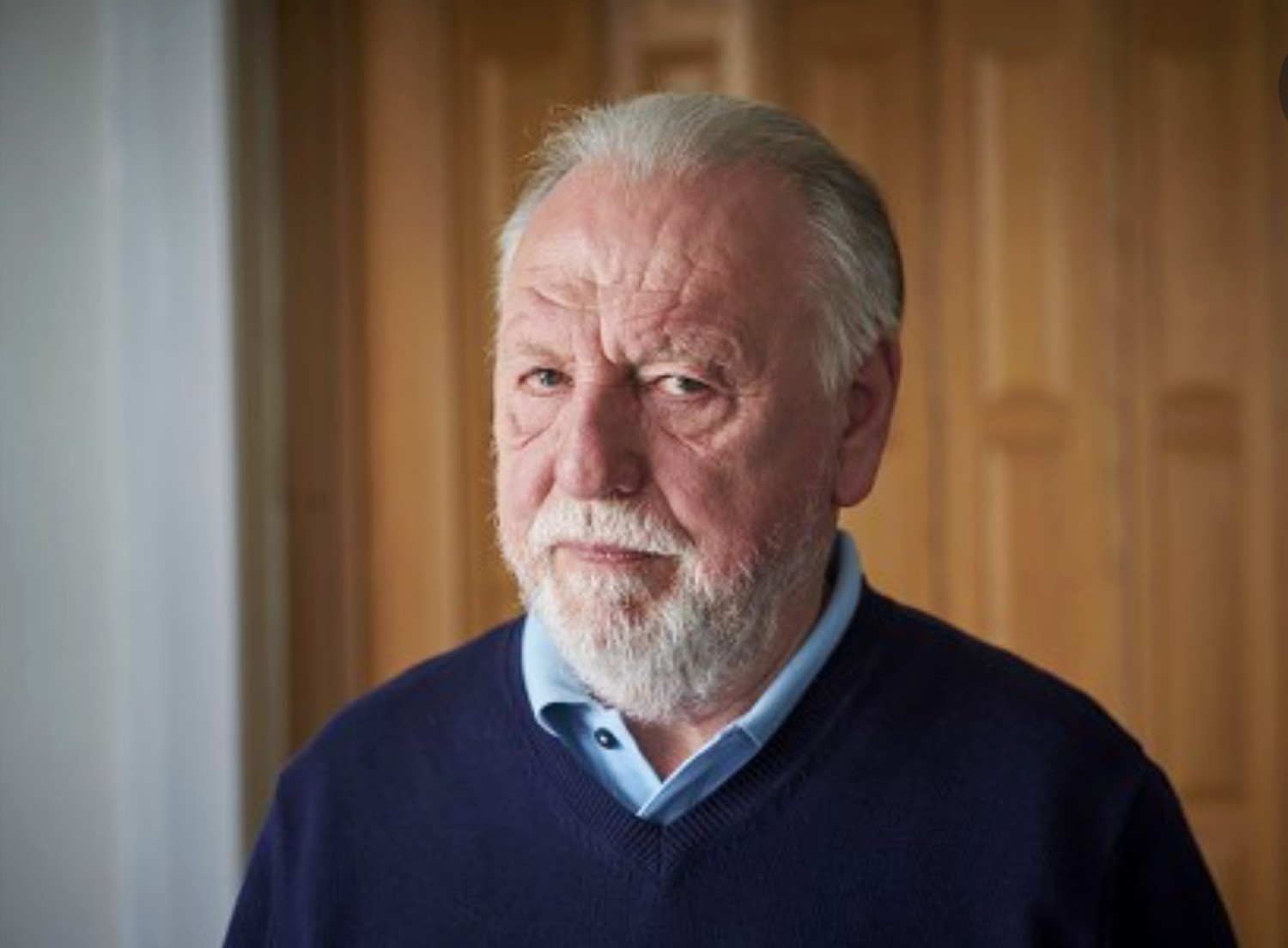 Kenneth Cranham looking at the camera with a straight face