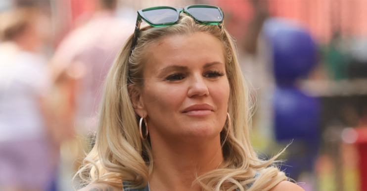 Kerry Katona with sunglasses on her head