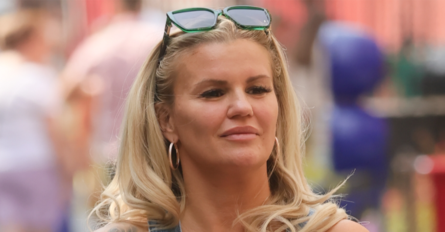 Kerry Katona with sunglasses on her head