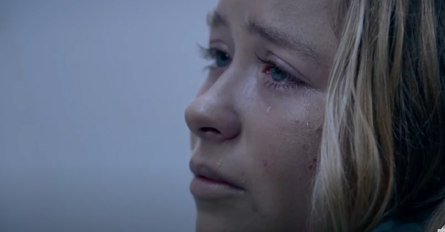 Close up of Liv's face in Emmerdale as she cries