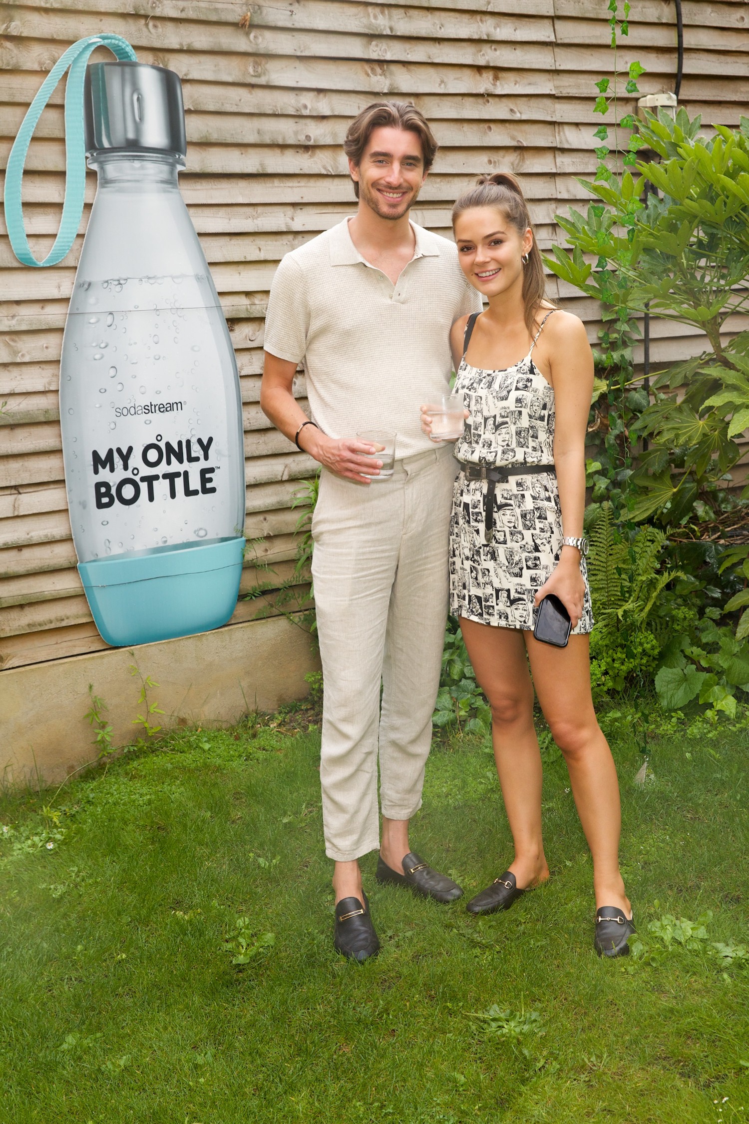 Melissa and Harry standing together in a garden