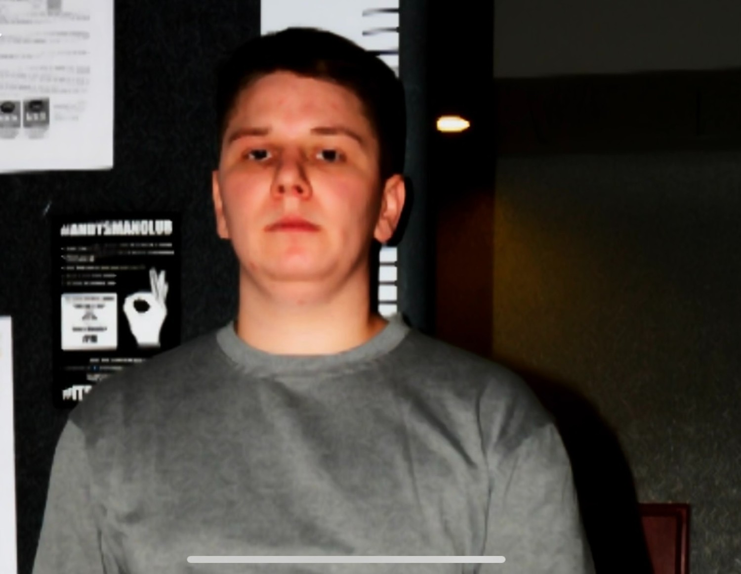 Pawel Relowicz frowning in prison mugshot