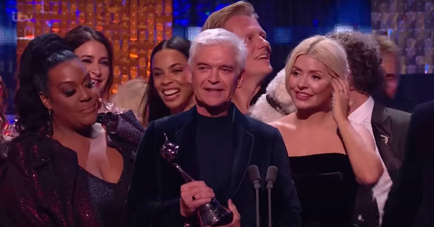Phillip Schofield smiles while accepting NTA