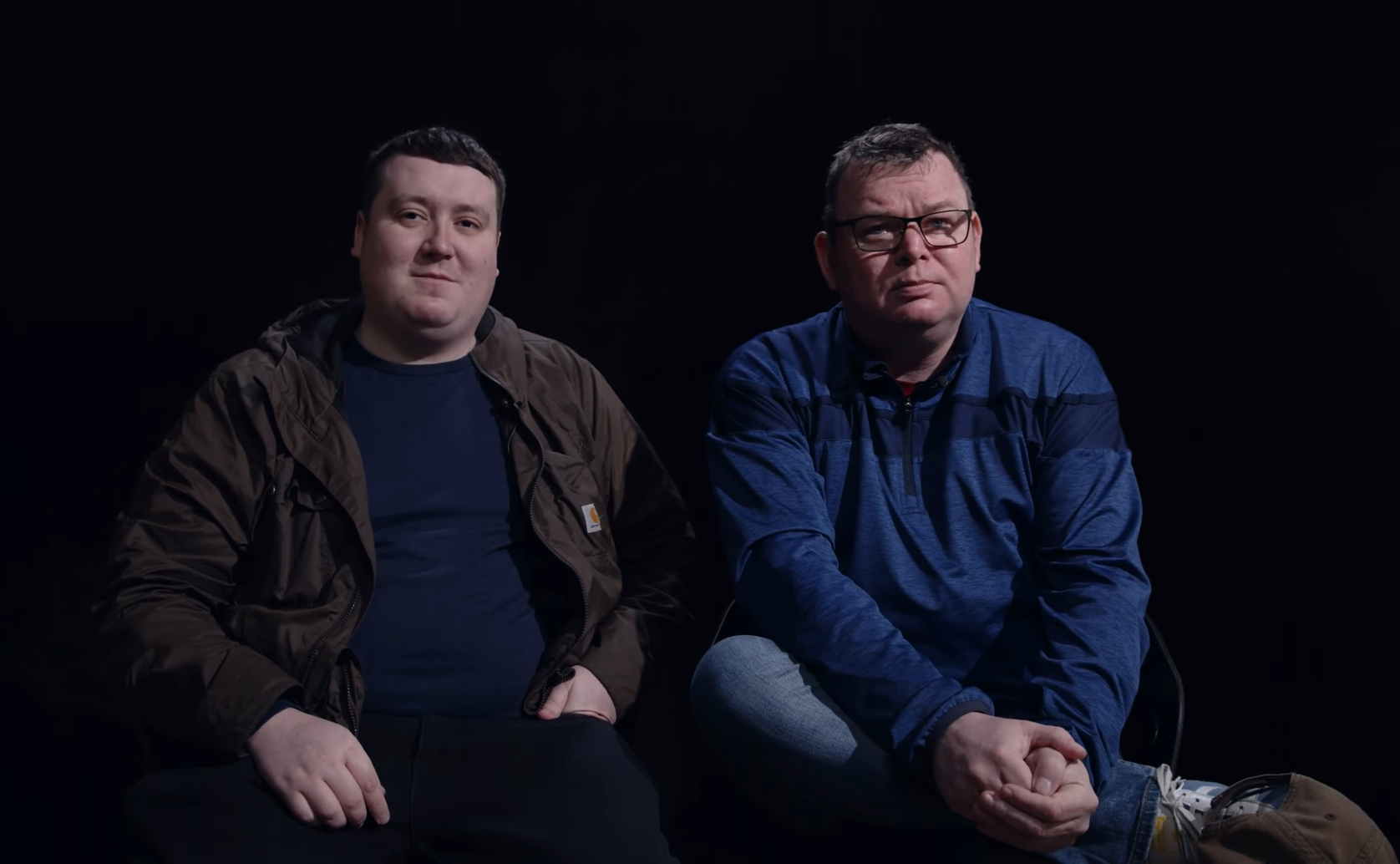 Robbie Mullen (left) and Matthew Collins (right), they smile in an interview in blue shirts