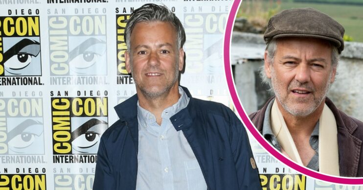 Rupert Graves smiling and wearing a sling in Doc Martin
