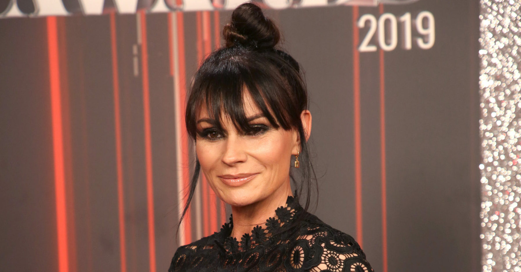 Lucy Pargeter on the red carpet at the British Soap Awards with her hair in a bun