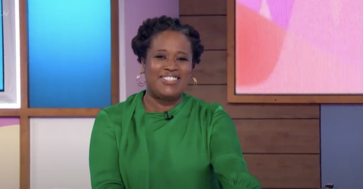 Charlene White smiling behind Loose Women desk