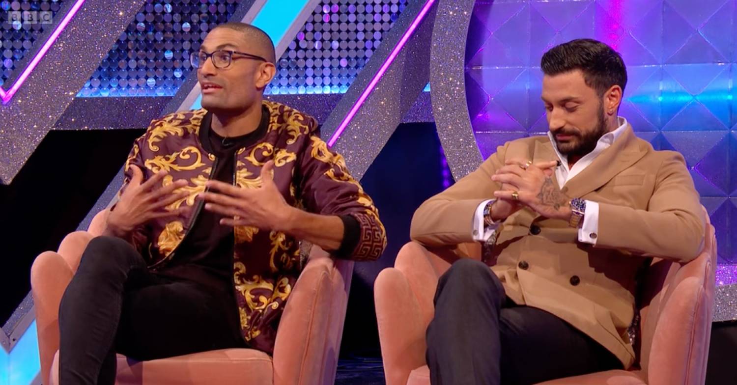Giovanni Pernice looks down and Richie Anderson raises his hands on It Takes Two