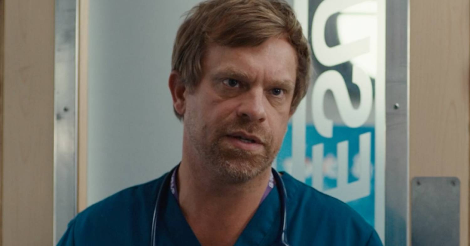 William Beck looks serious in character in Casualty