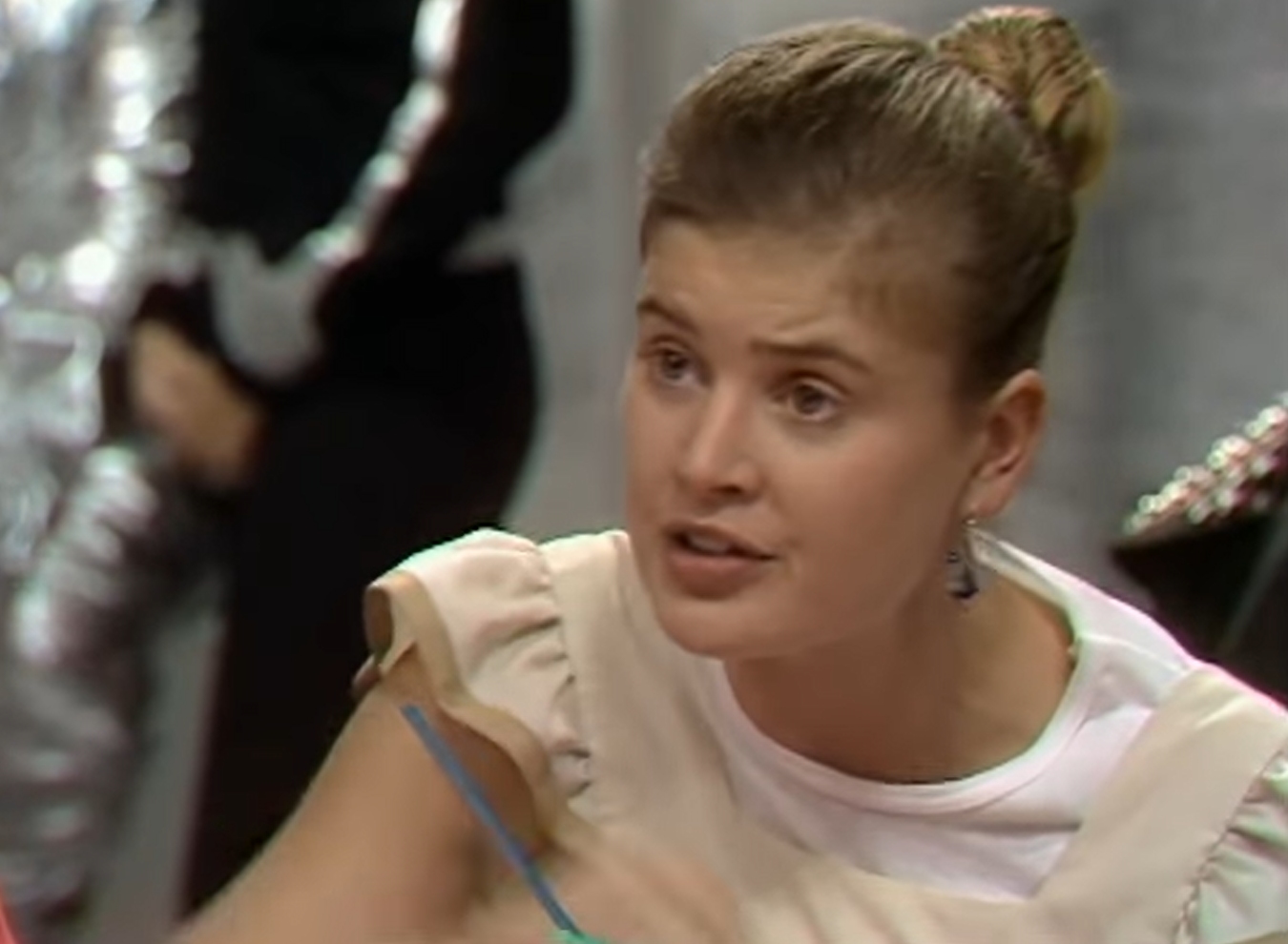 Sophie ALdred as Ace in Doctor Who, she has a concerned expression as she talks to the doctor
