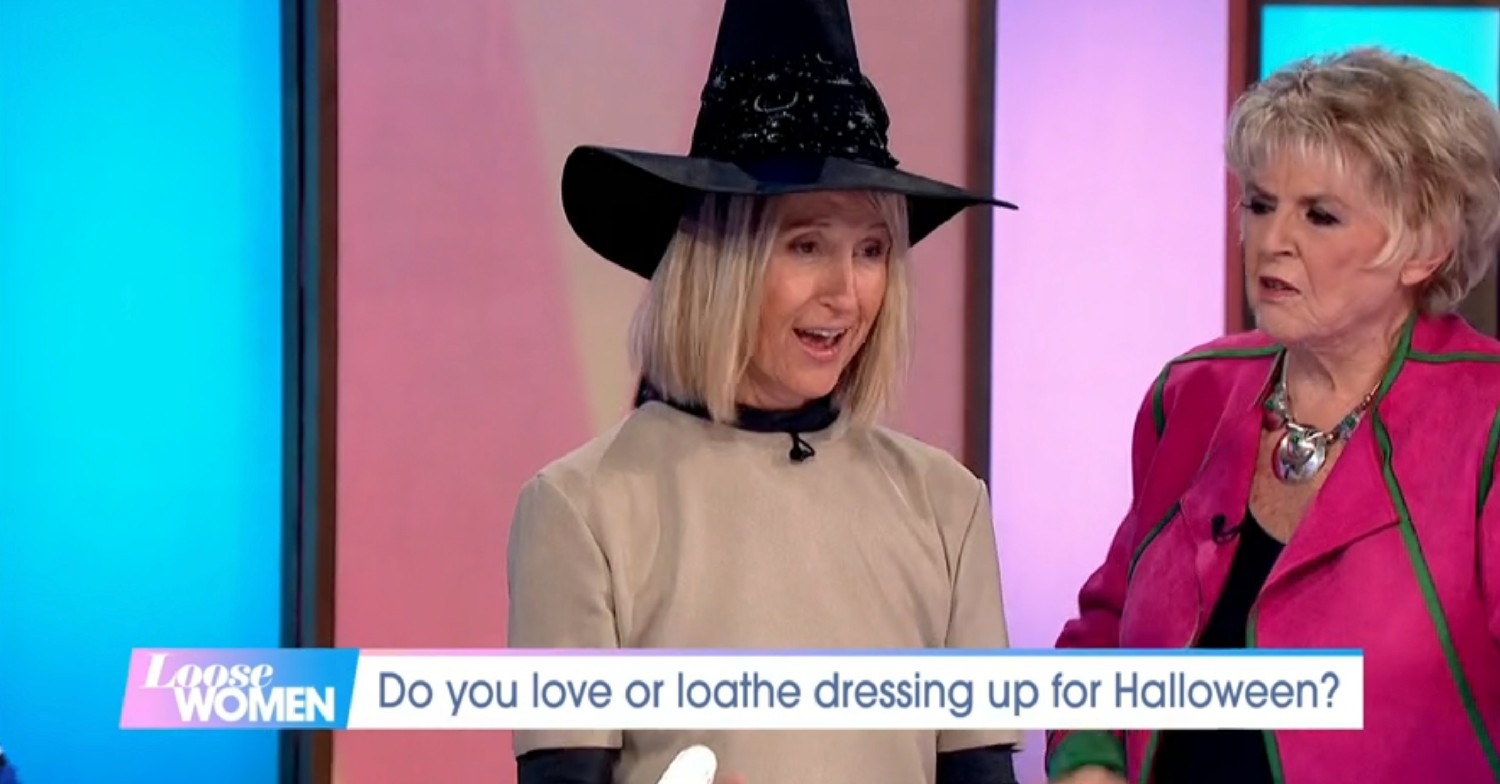Carol McGiffin wearing a witches hat on Loose Women today next to Gloria Hunniford 