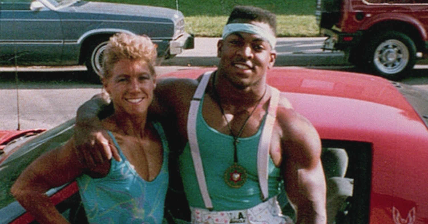 Sally McNeil and her husband Ray standing beside each other in front of a car in an old photo in Killer Sally on Netflix