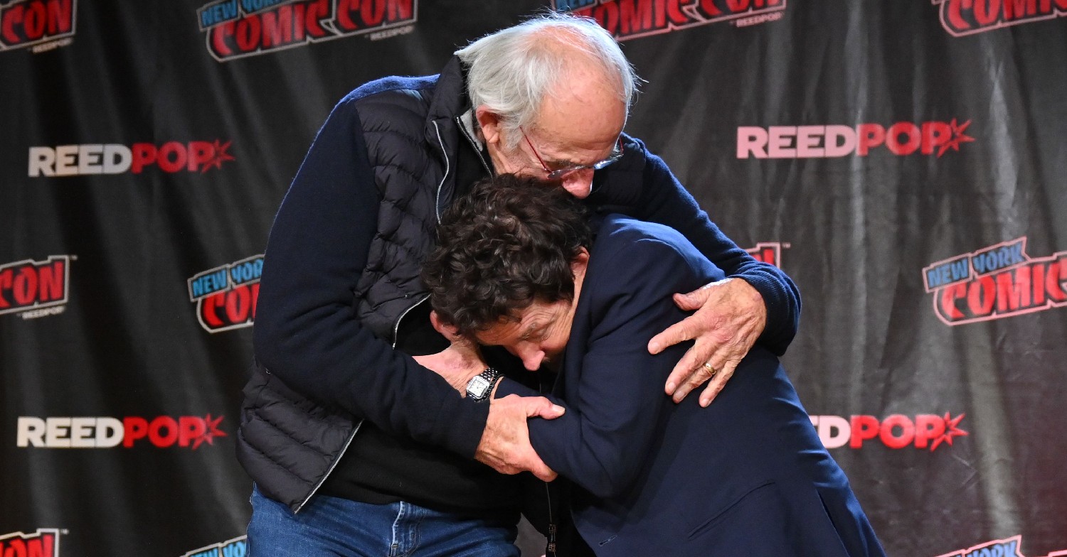 Michael J Fox and Christopher Lloyd embracing at New York Comic Con