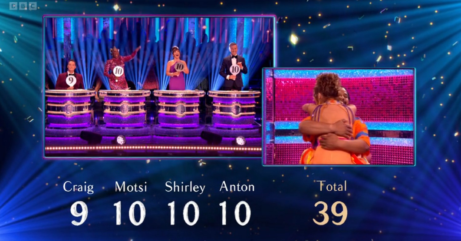 Craig Revel Horwood, Shirley Ballas, Motsi Mabuse, Anton Du Beke scoring Hamza and Jowita, who are hugging, on Strictly 