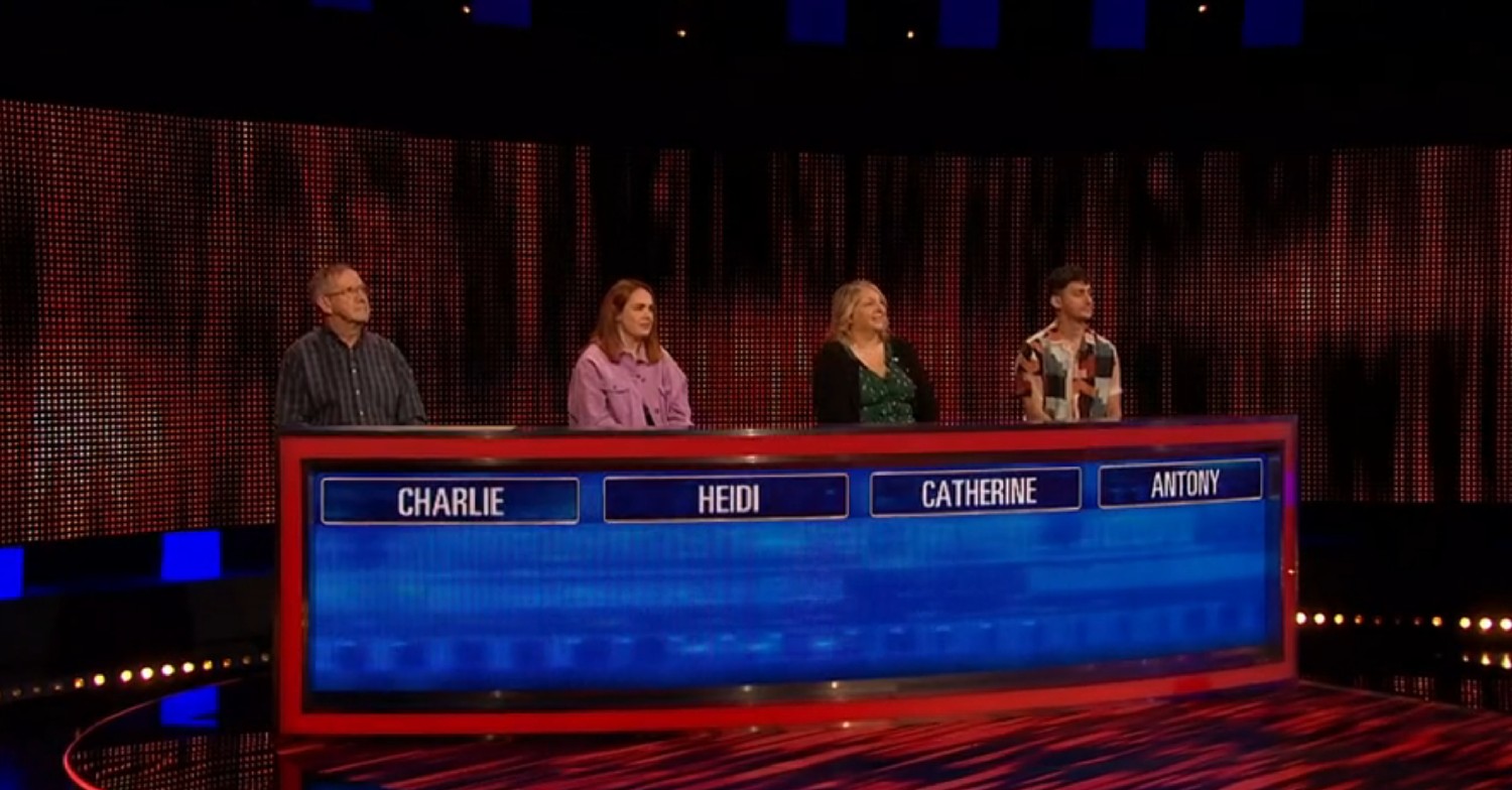 The Chase contestants stood behind desk