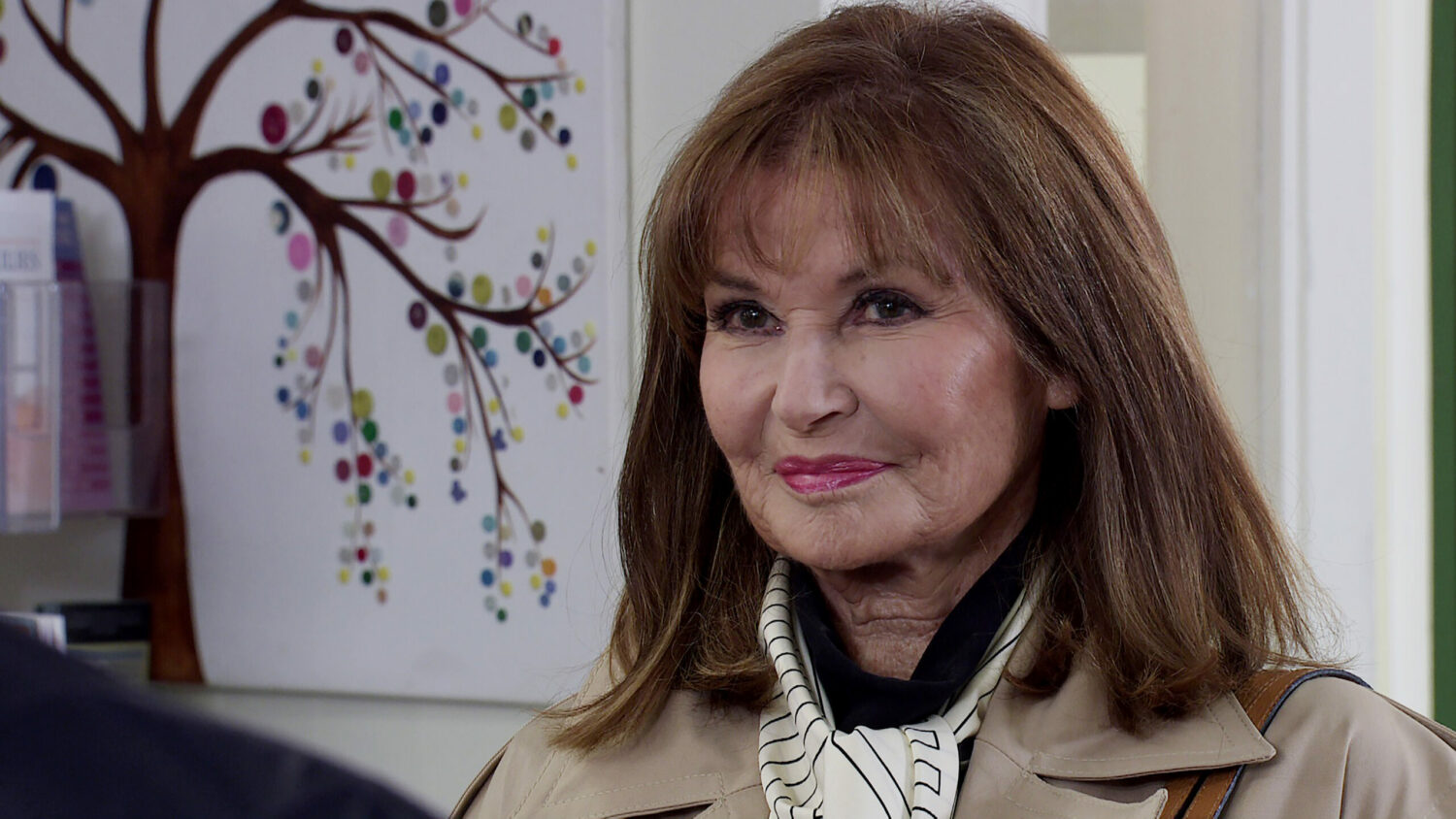 Martha smiling on Coronation Street