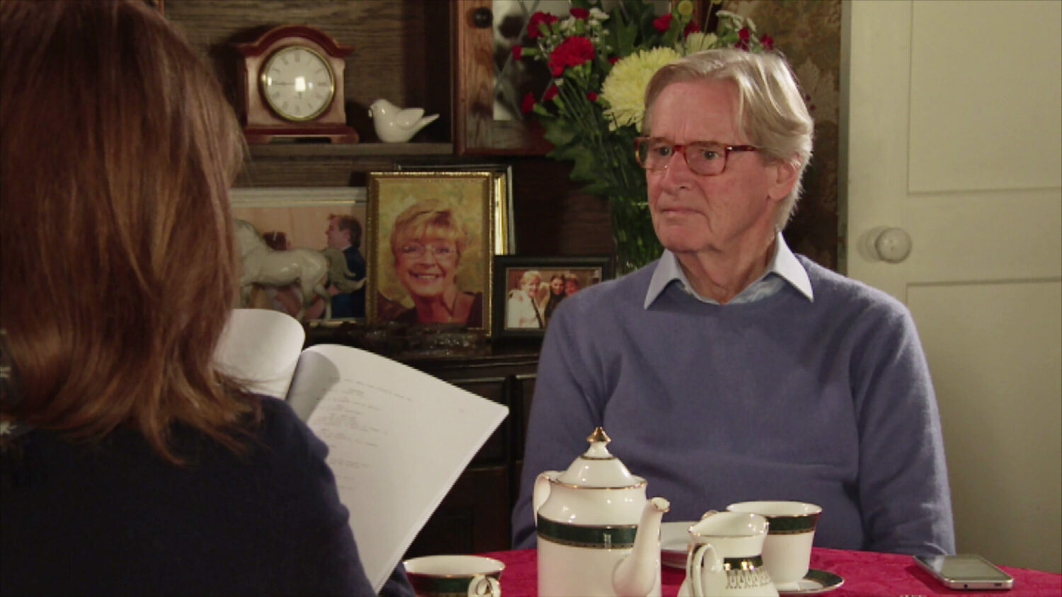 Ken Barlow looks uncomfortable with Martha at his house drinking tea