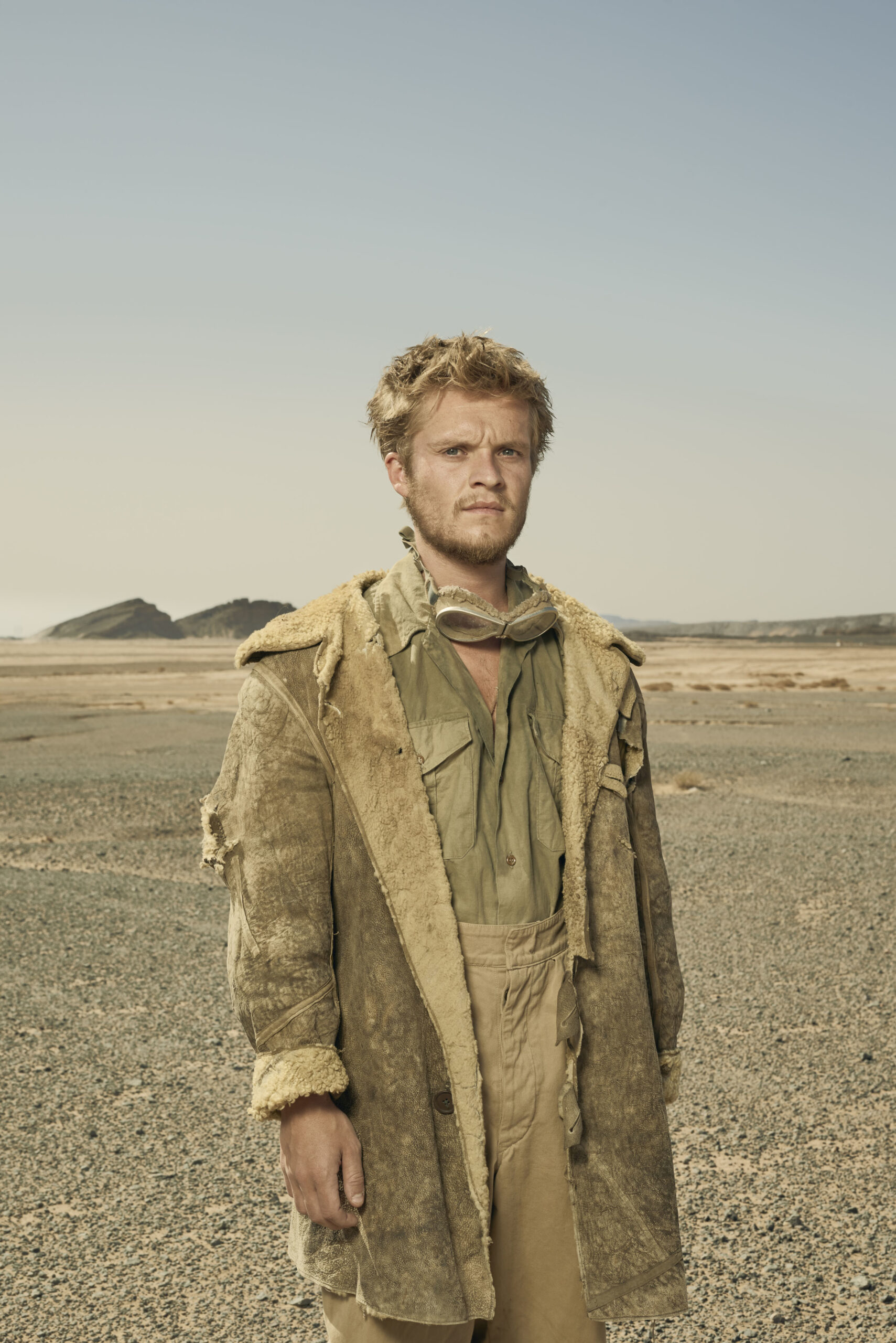 Tom Glynn-Carney standing in the desert 