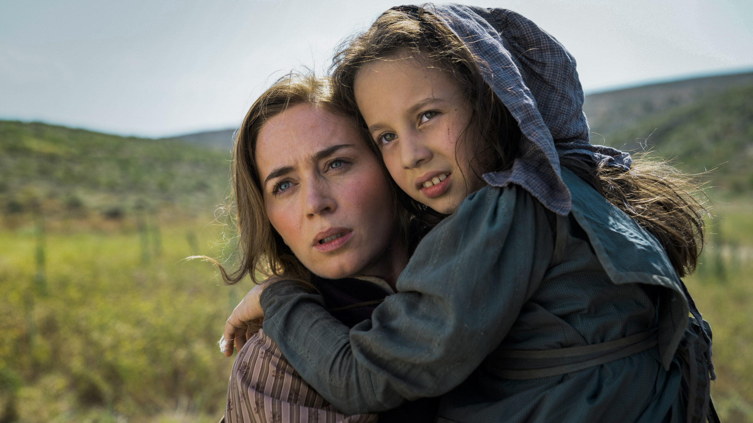 Cornelia holds a native american girl outside in The English