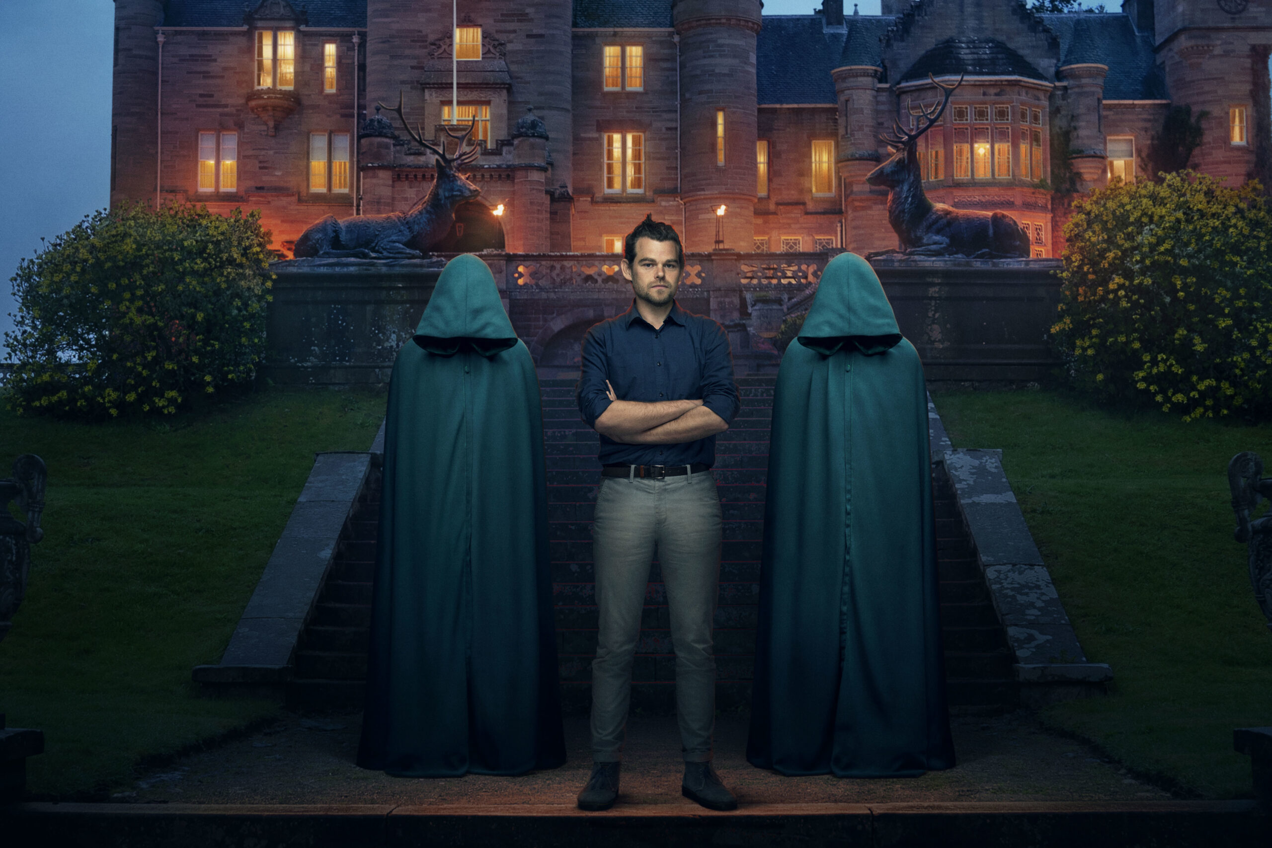 Ivan stands between the two hoods
