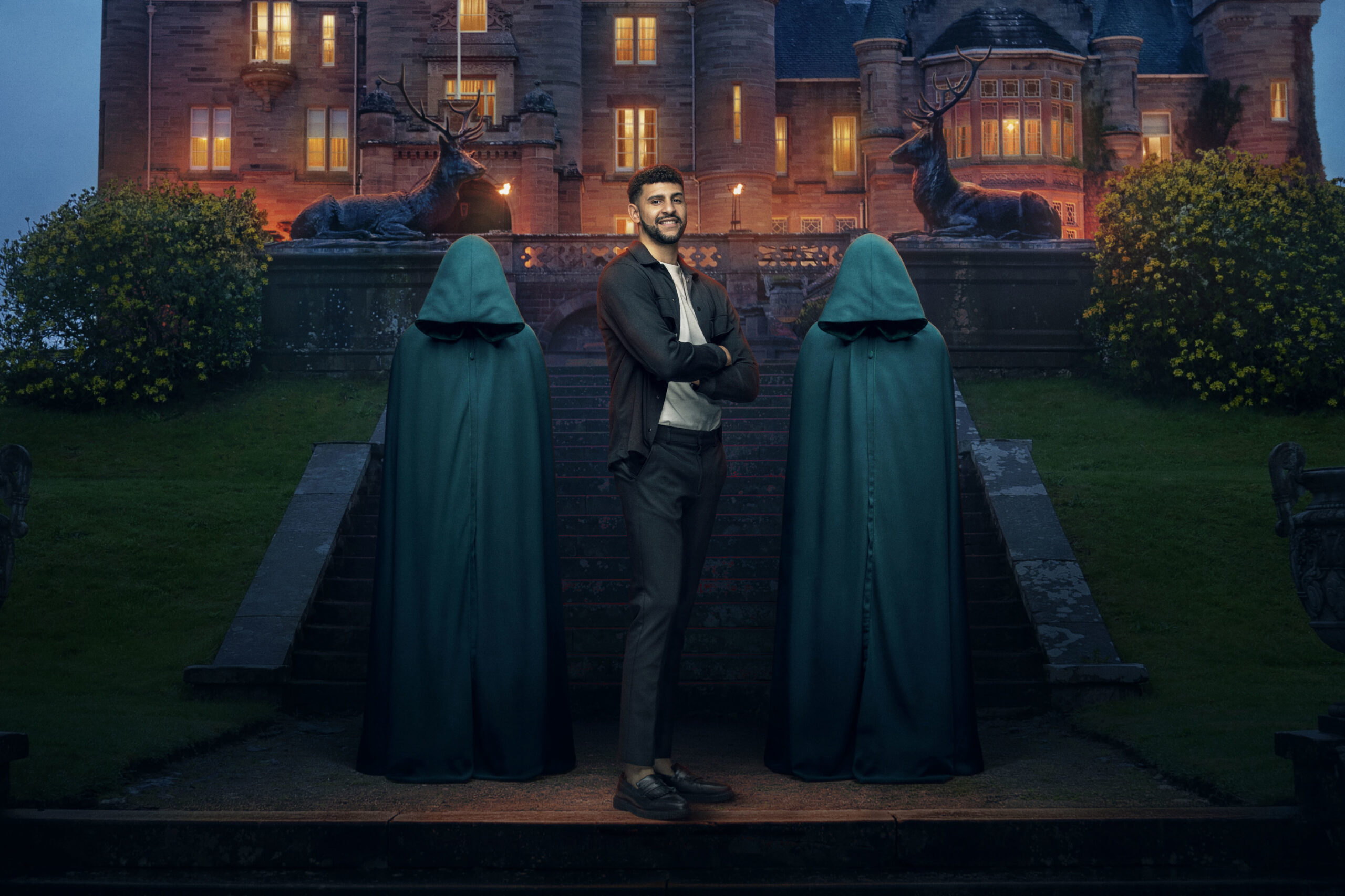 Contestant Theo stands between The Traitors