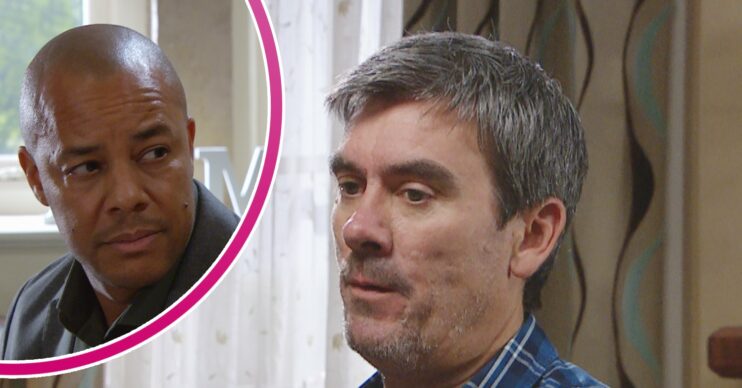Al looking worried and Cain looking annoyed in Emmerdale