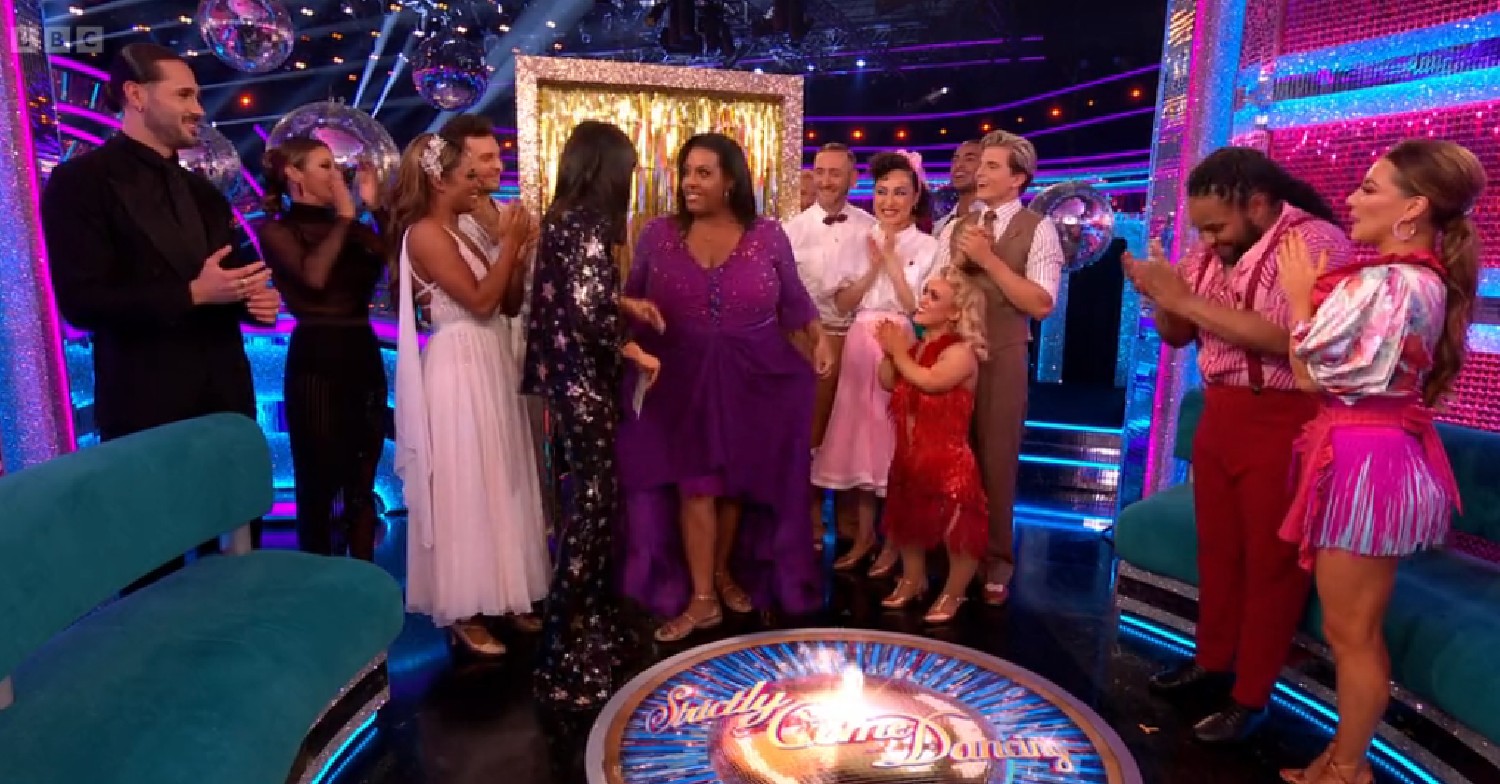 Alison Hammond surrounded by Strictly stars in purple dress