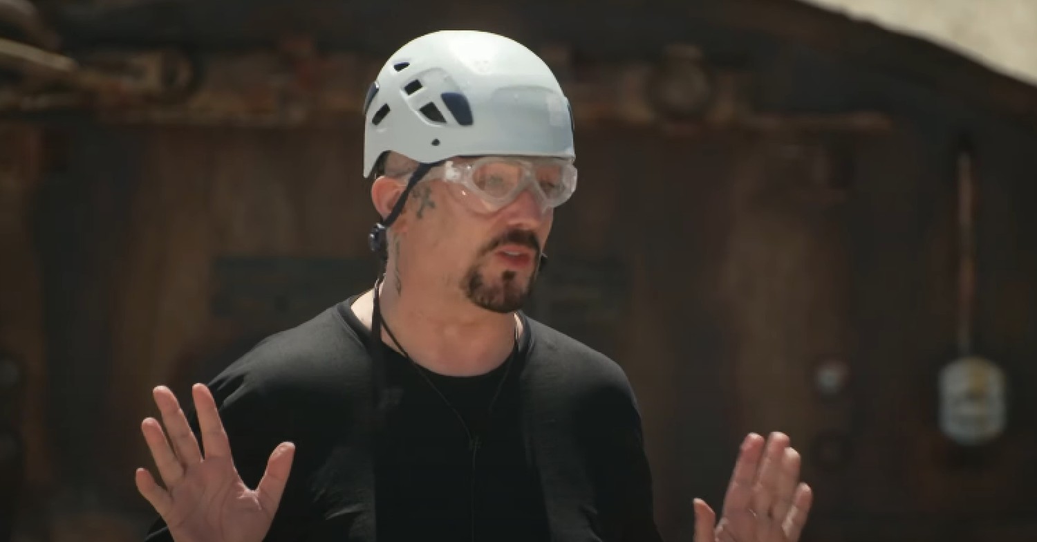 Boy George with his arms up during I'm A Celebrity trial