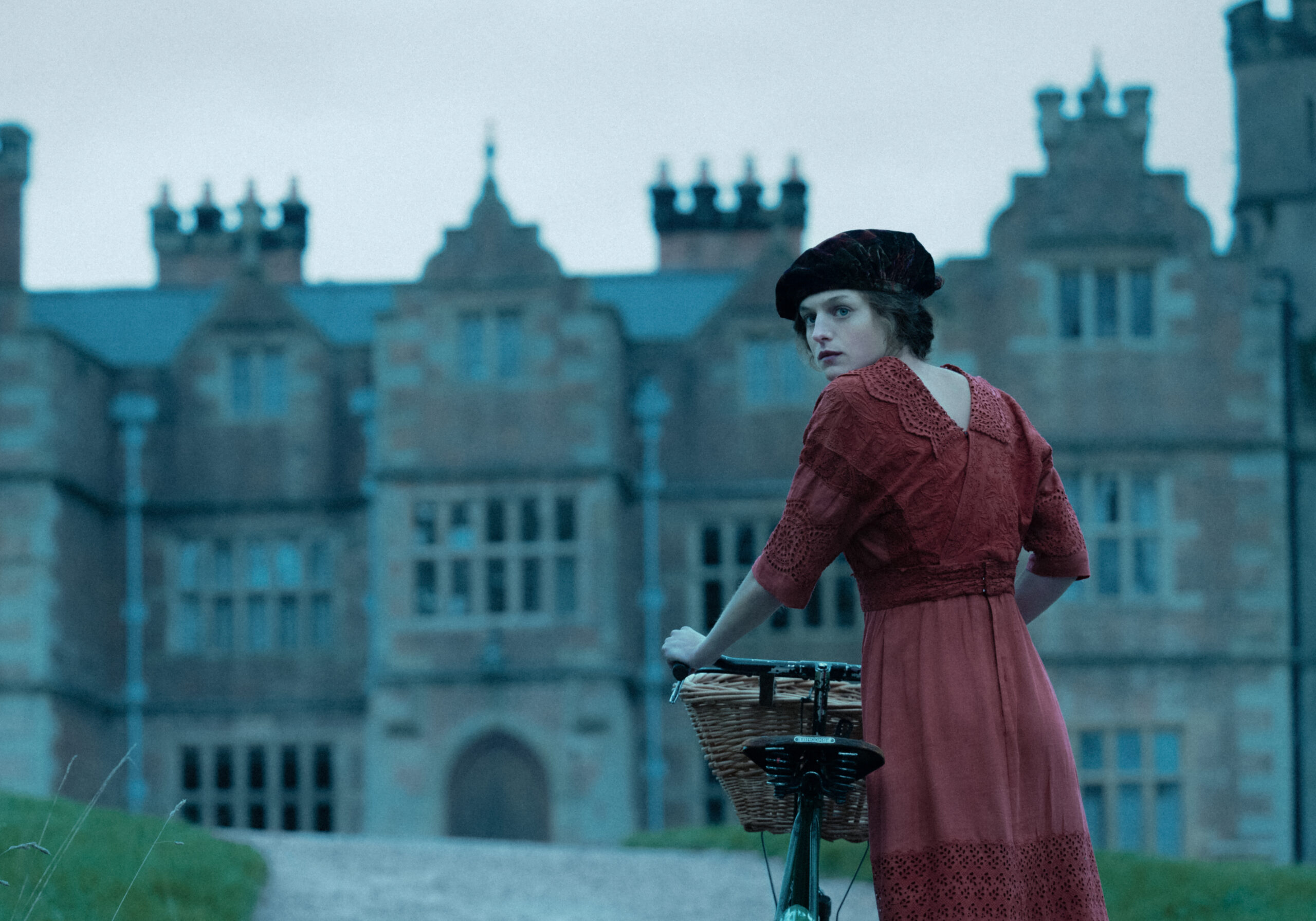 Connie looks behind her shoulder in Lady Chatterley's Lover
