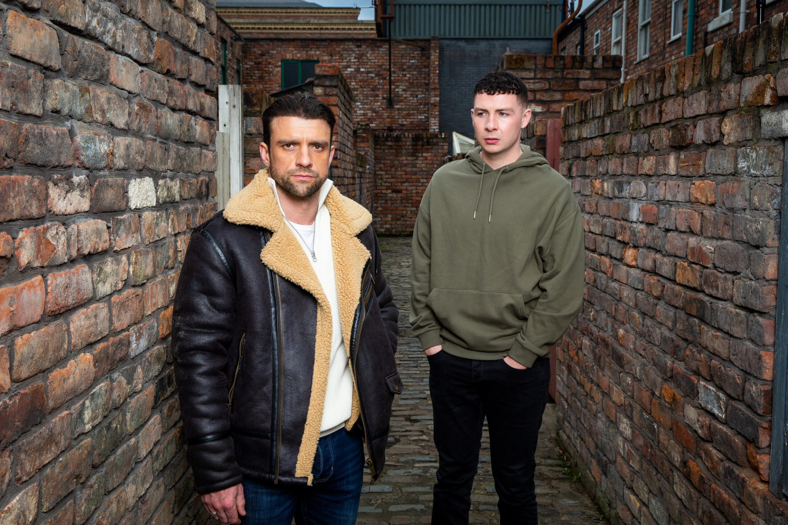 Jacob looking worried at his dad Damon in Corrie