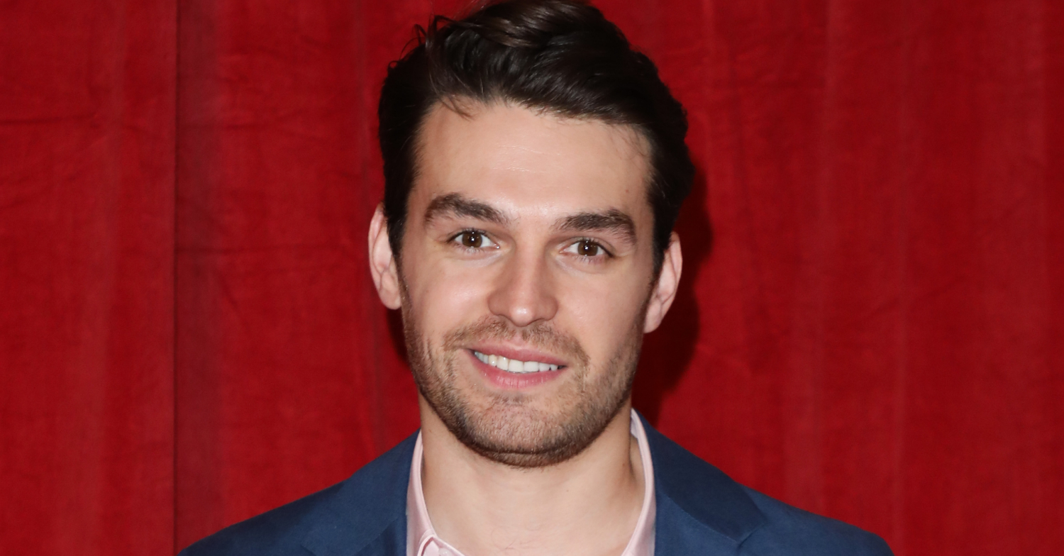 Emmerdale's Lawrence J Robb smiling on the red carpet