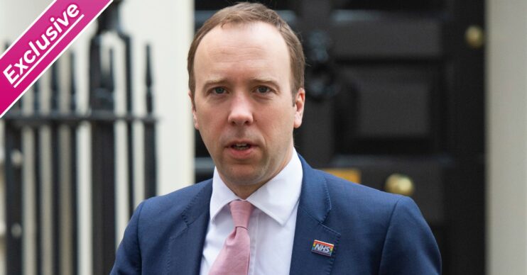 Matt Hancock looks worried outside Downing Street with exclusive banner