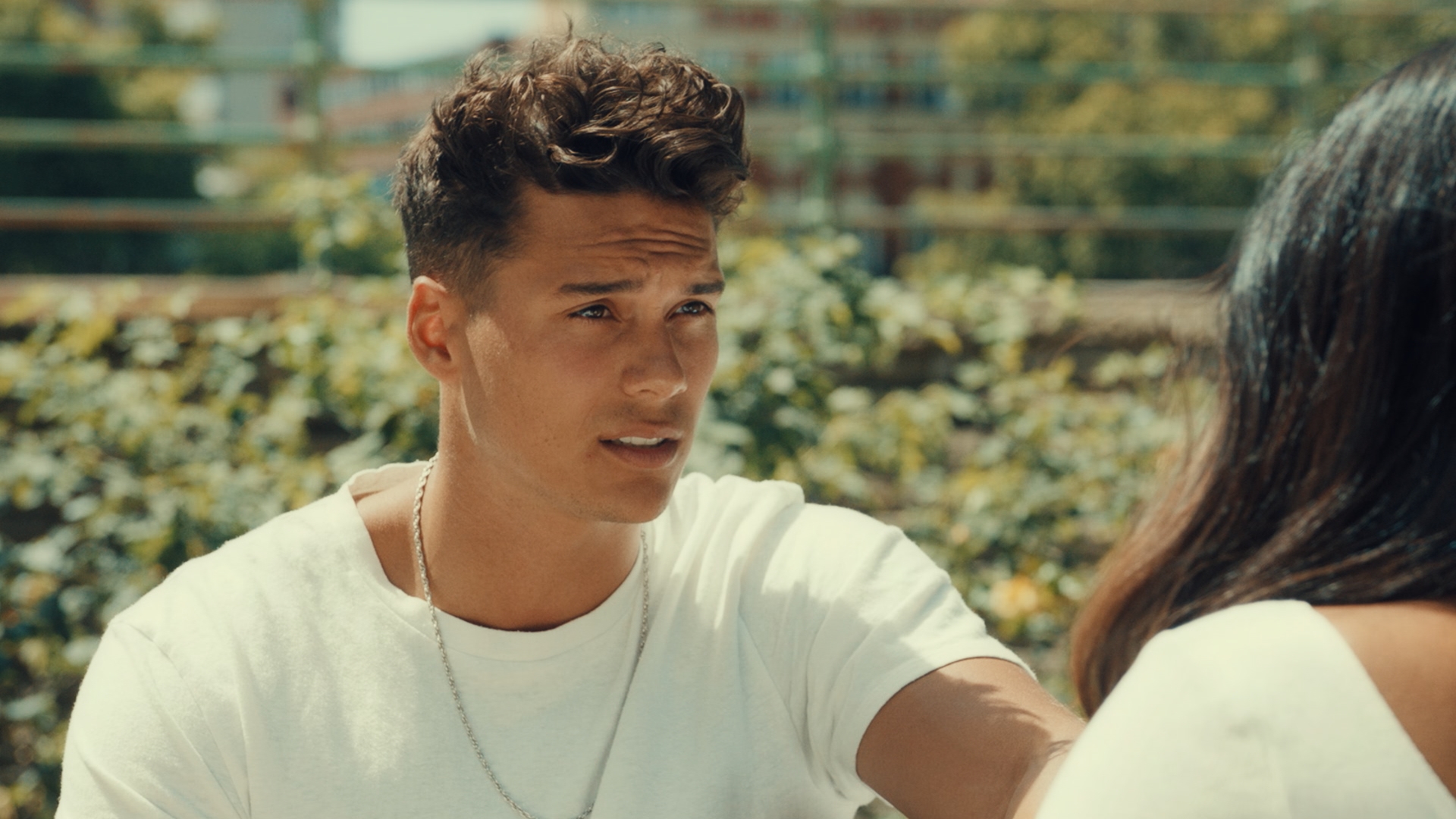 Miles sitting outside in Made In Chelsea