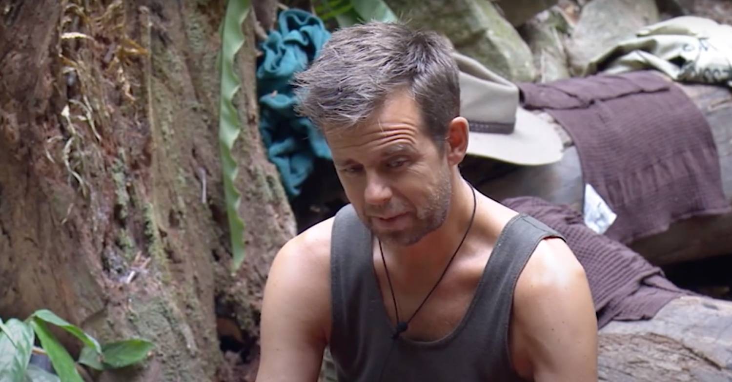 Former I'm A Celebrity contestant Pat Sharp sits in the jungle camp