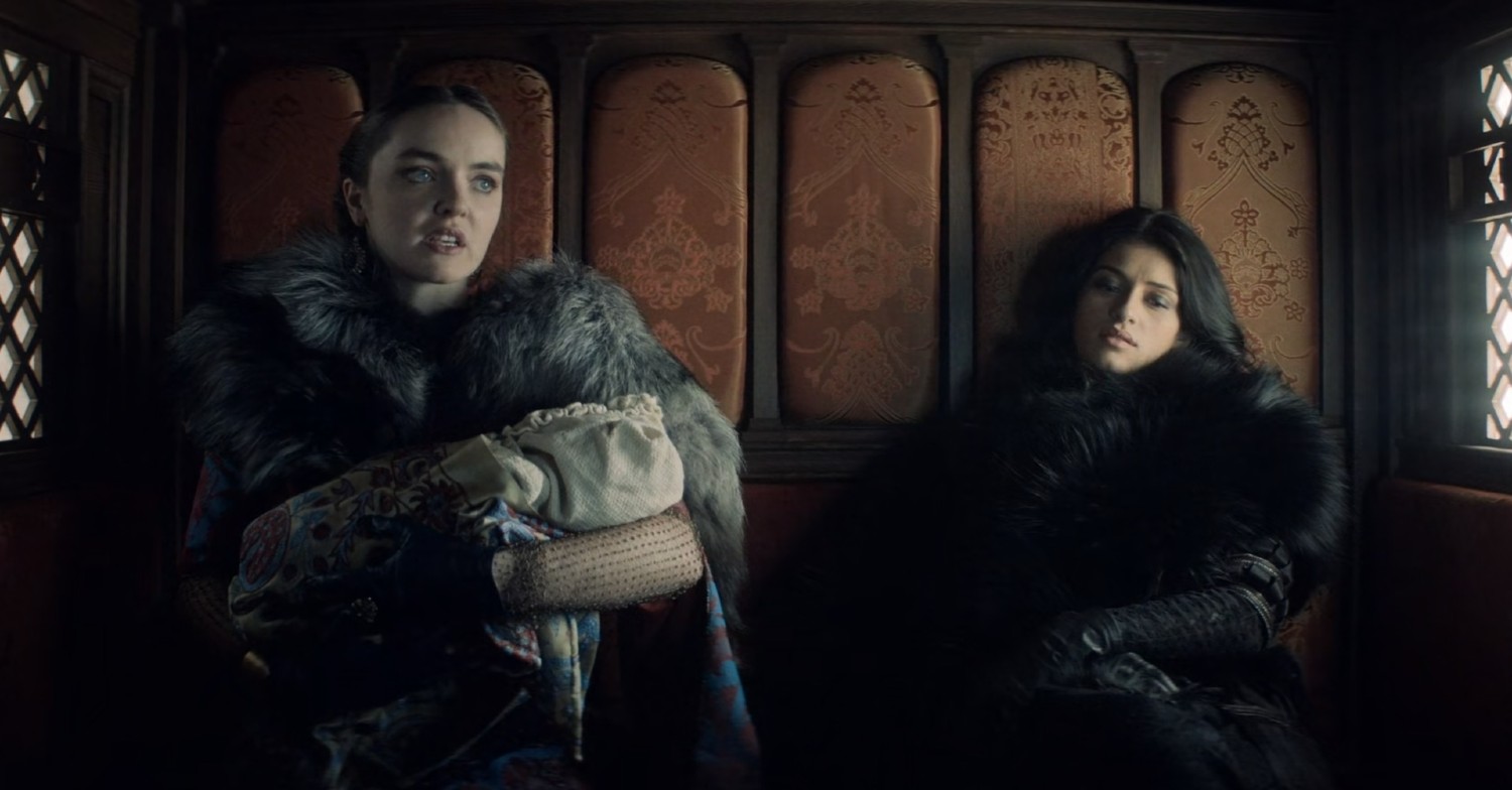 Isobel Laidler holding a baby in The Witcher