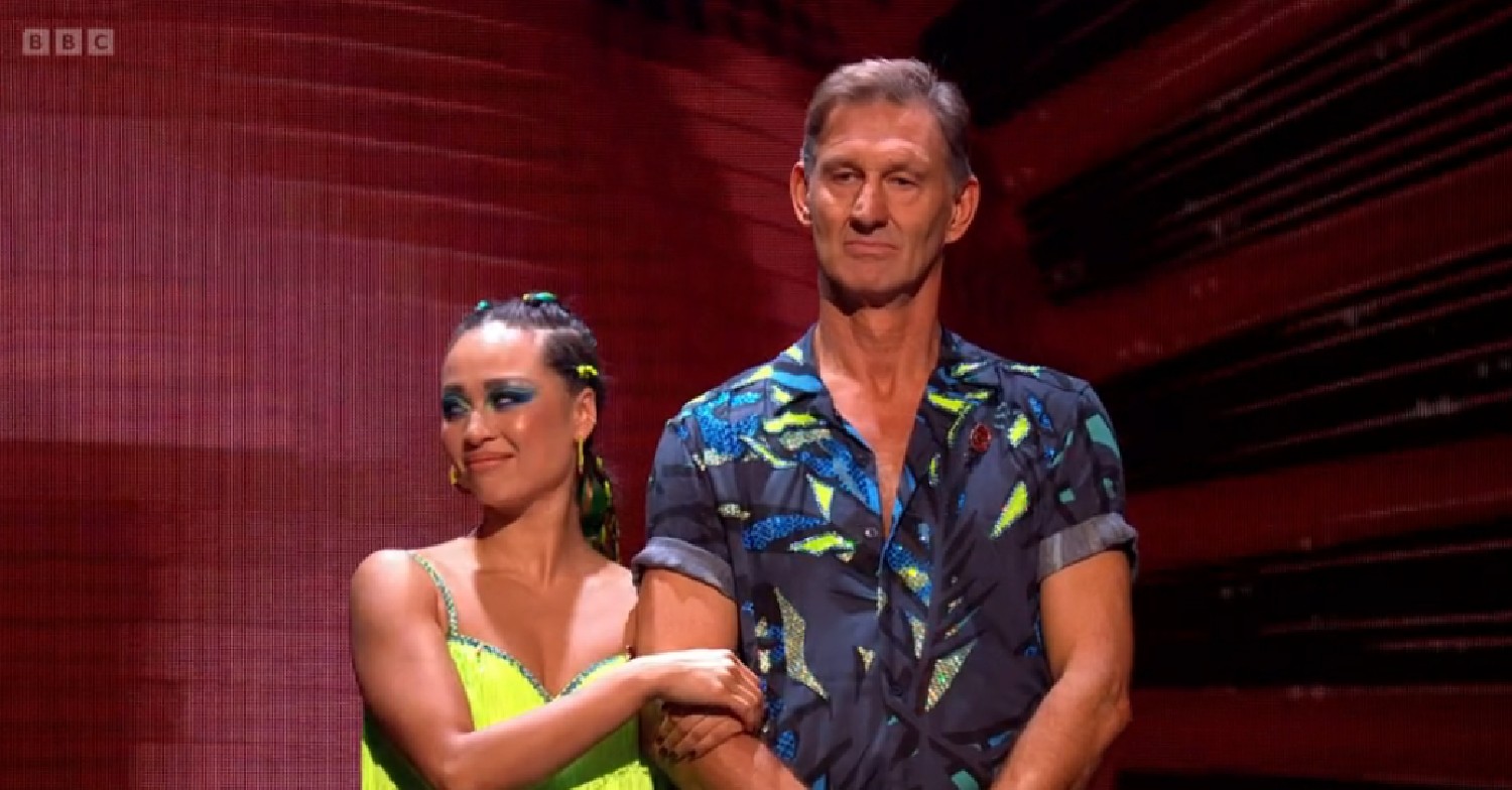Katya Jones linking Tony Adams' arm during Strictly results show