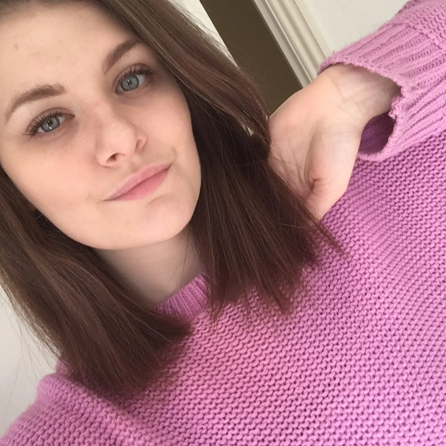 Libby Squire brushing her hair back in a selfie