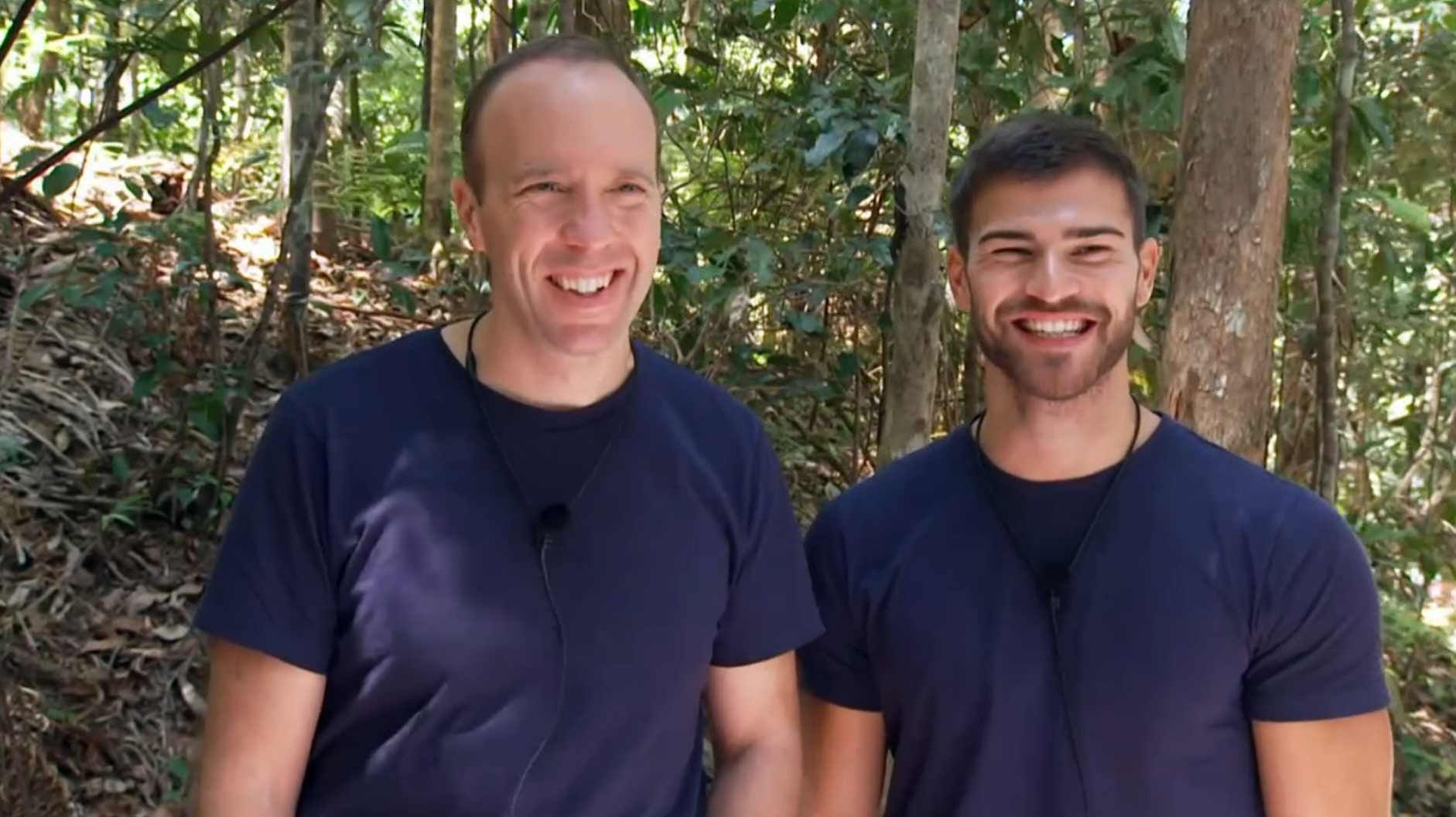 Matt Hancock and Owen Warner smile as they head to a bushtucker trial on I'm A Celebrity