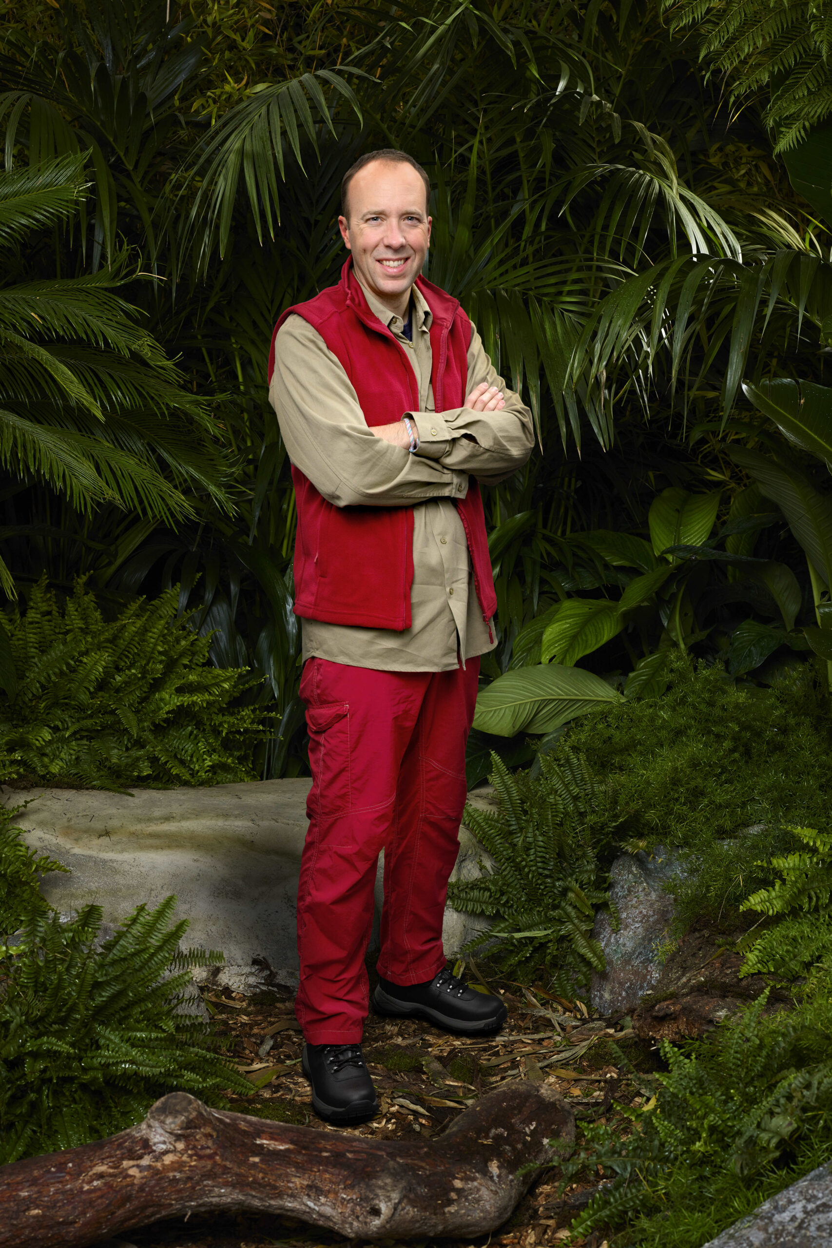 Matt Hancock smiles and crosses arms in I'm A Celeb promo pic