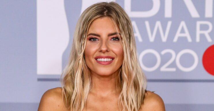 Mollie King smiling at the BRIT Awards