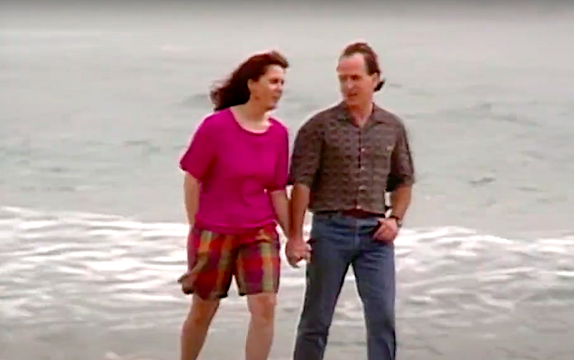 Michael and Pippa hold hands beside the sea in Home and Away