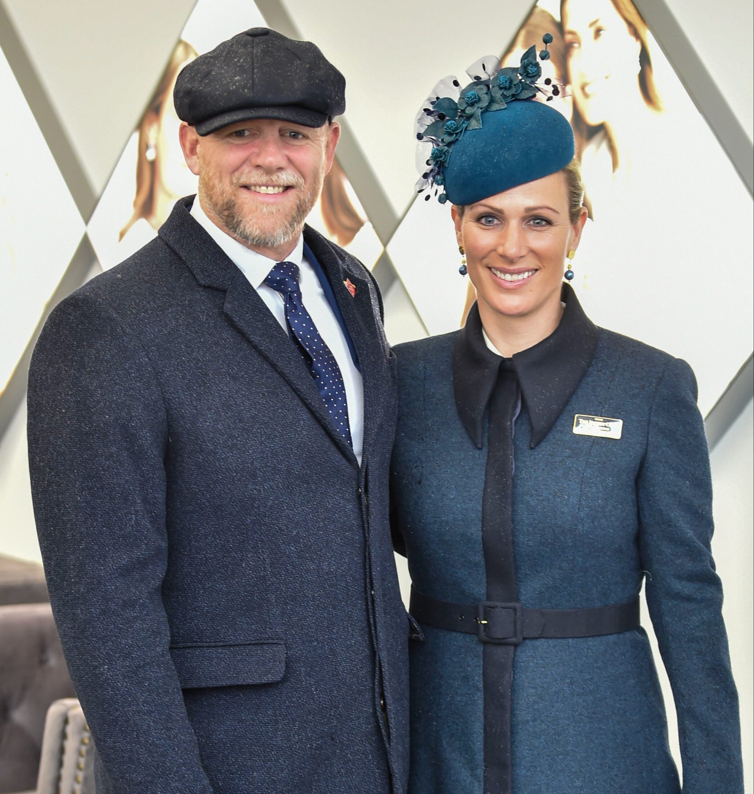 Mike and Zara Tindall smiling wearing hats and coats