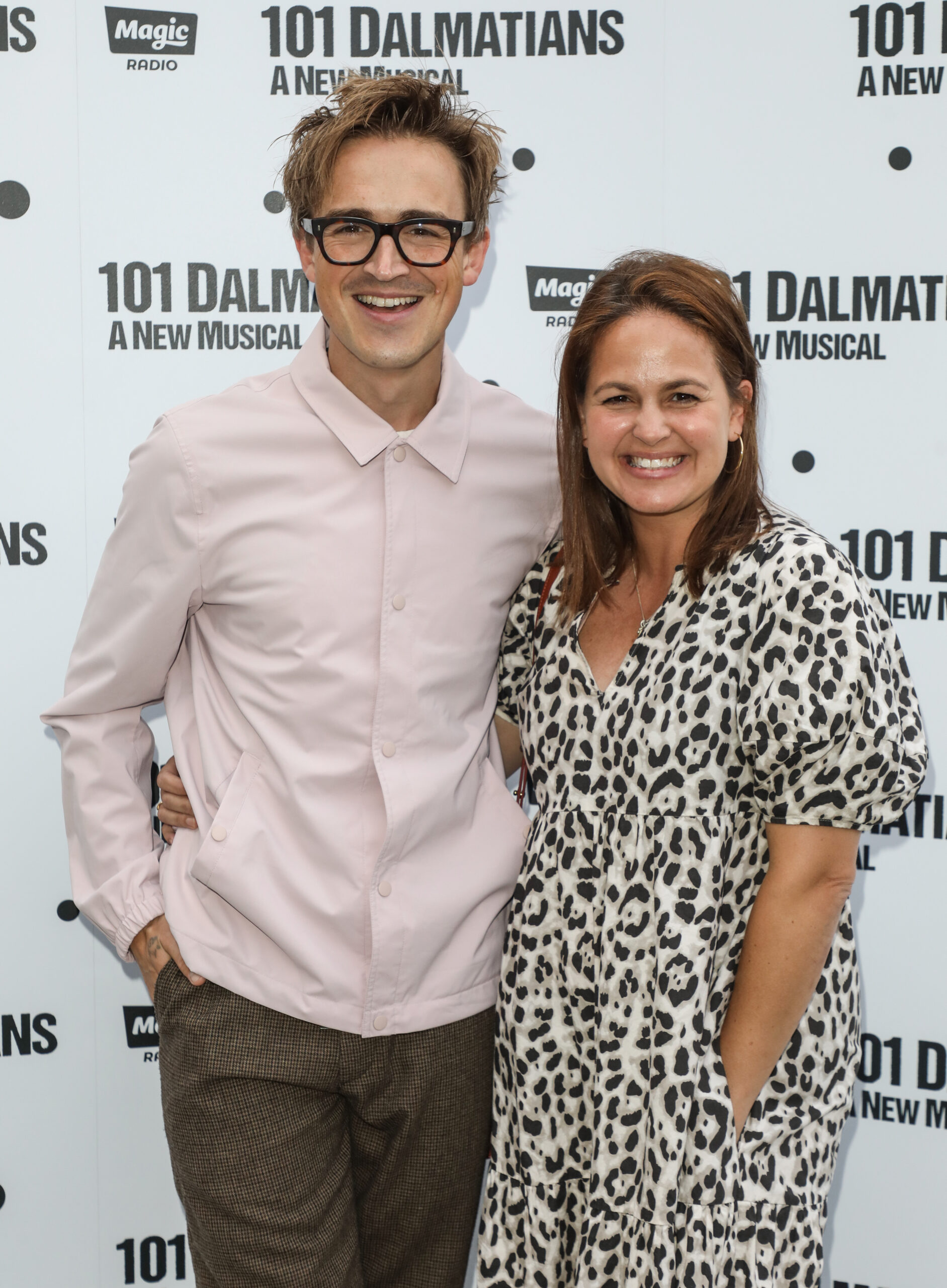 Tom Fletcher and Giovanna Fletcher smiling on red carpet