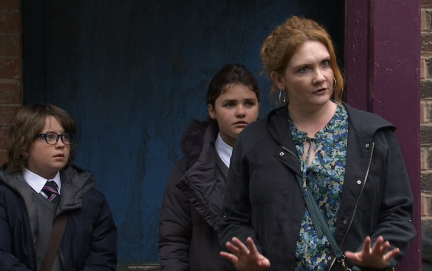 Coronation Street's Fiz looking animated with Sam and Hope behind her, upset