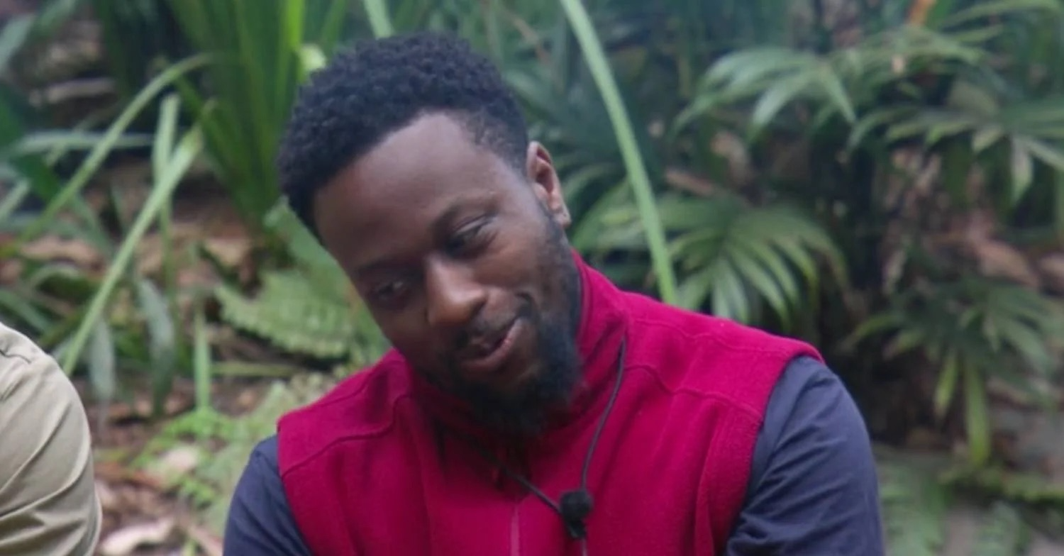 Babatunde smirking on I'm A Celebrity