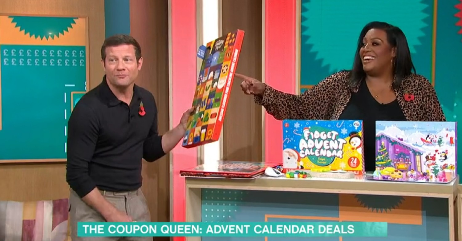 Dermot O'Leary holding an advent calendar as Alison hammond laughs on This Morning today