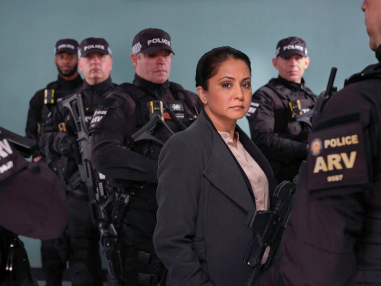 DI Ray stands with a group of police officers