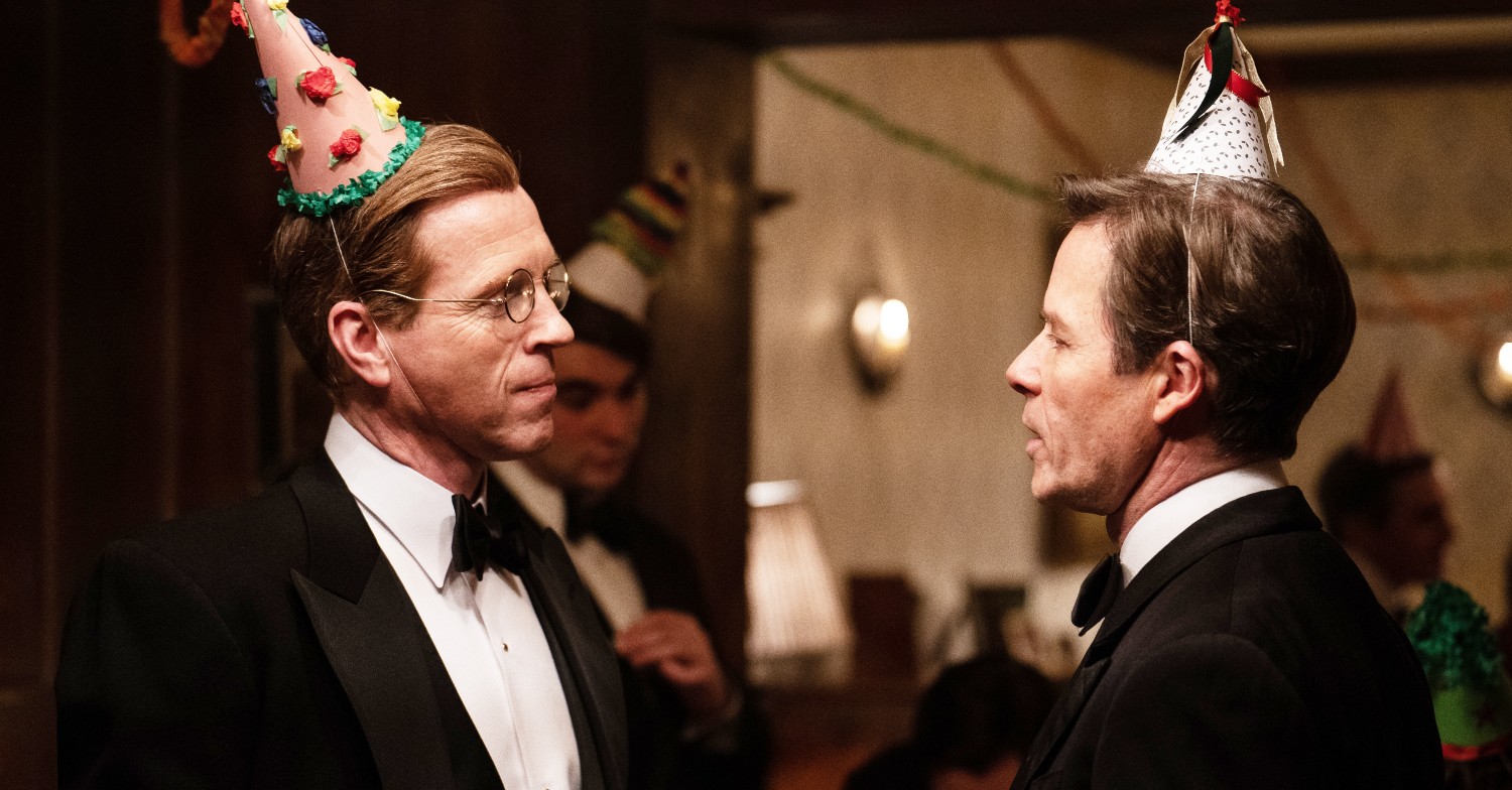 Guy Pearce and Damian Lewis as Philby and Elliott in party hats