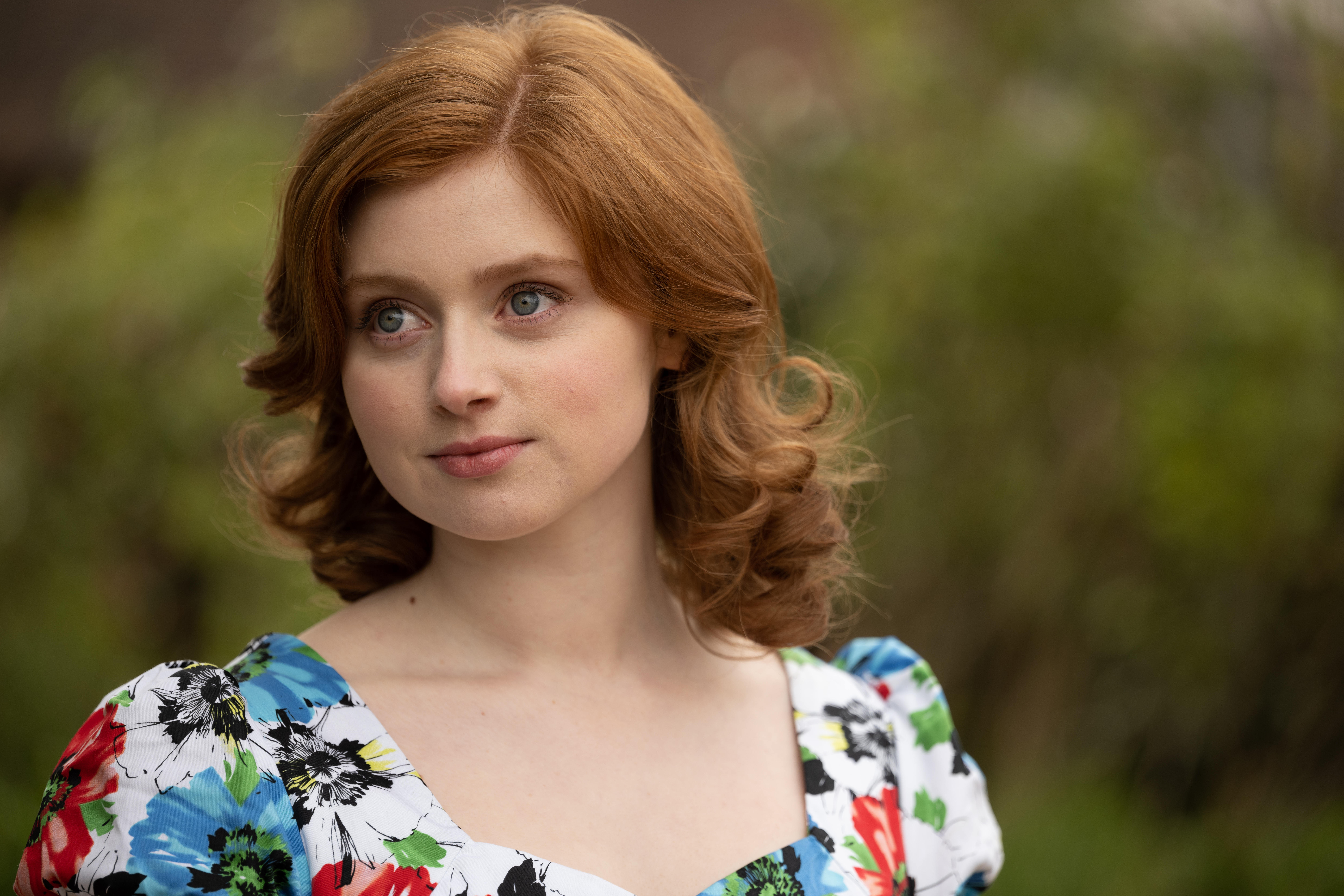 Lydia Page looking to the side in The Larkins